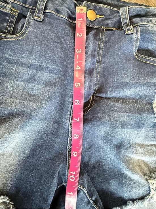 Distressed High-Rise Denim Shorts in Blue - Picture 4 of 7